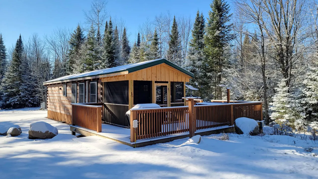 The Modern Pine and its screened deck after a snowfall, Malone, New York