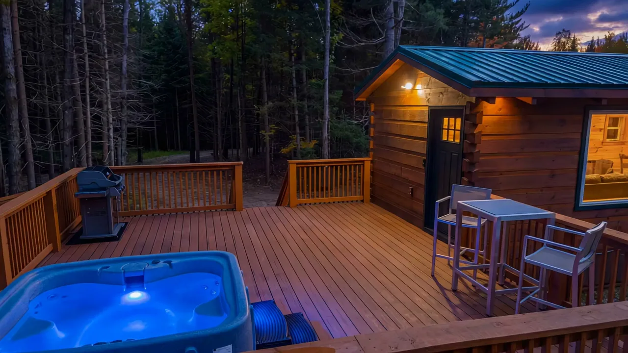 The Aviator's hot tub lit at dusk on the deck