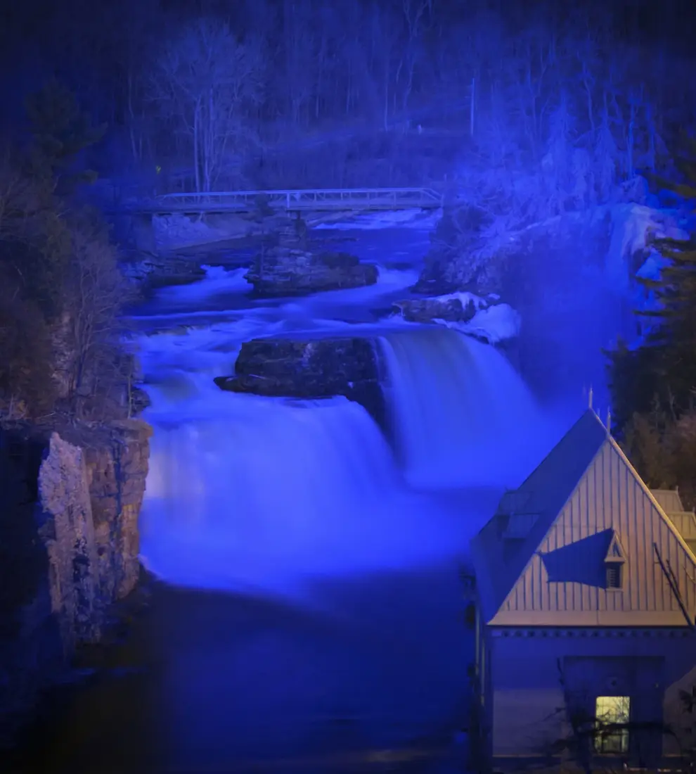 The falls at Ausable Chasm lit at dusk