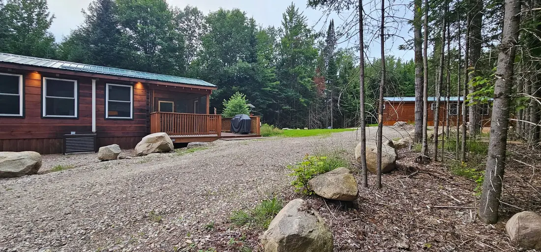 The gravel drive and the cabins among the pines