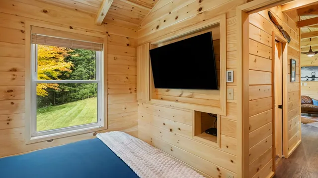 The Aviator's main bedroom with a wall-mounted TV