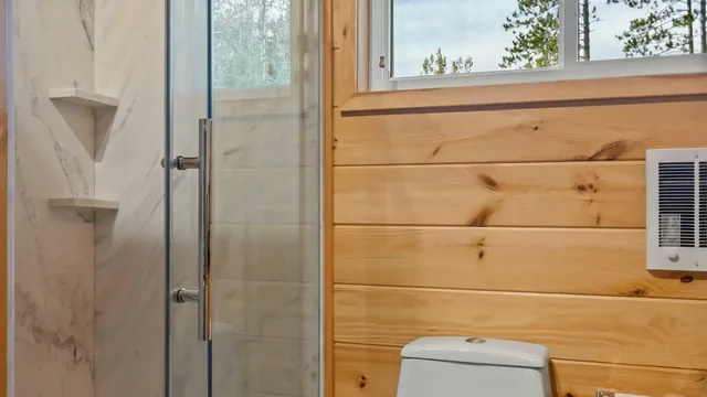 The Modern Tiny Home's bathroom with a glass shower