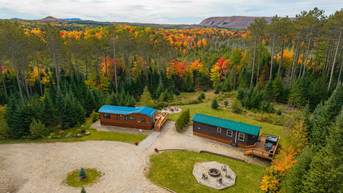 The Modern Tiny Home's property from above, with the neighboring cabin and the stone fire pit