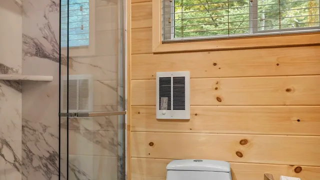 The Modern Pine's bathroom with a glass-walled shower