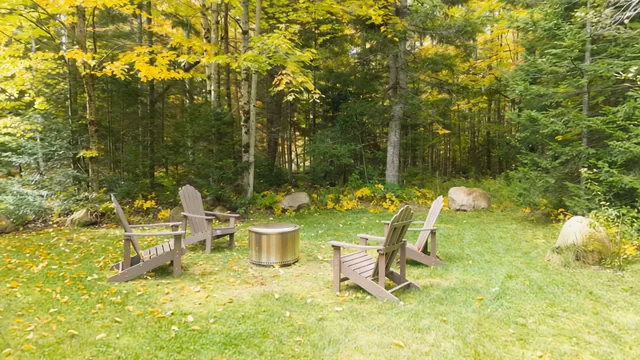 Adirondack chairs around the fire pit at The Modern Pine